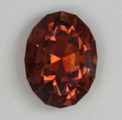 A Dravite Brown Orange Oval.