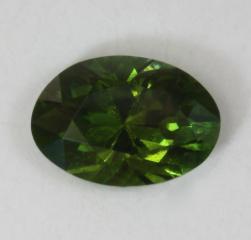 One of a matching pair of yellowish green ovals