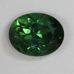 Very nice bright green oval with growth tubes.
