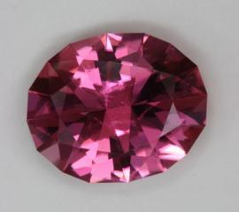 Bright, flashy, medium pink oval with flatter crown
