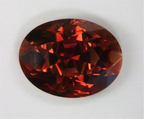 Deep, extremely dichroic cream/mahogany oval.