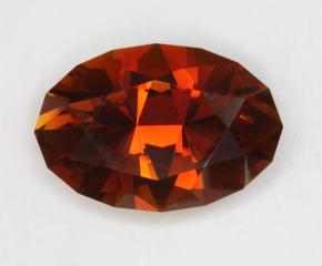 Orange and golden brown dichroic oval