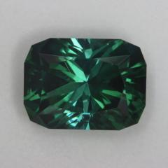 Slightly dichroic medium dark green Barion Cut Cushion.