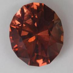 A browned orange Dravite oval.