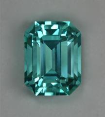 A cyan colored, neon bright, cuprian, GEM of an emerald cut.