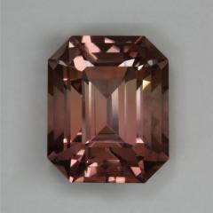 Medium pastel peach emerald cut.