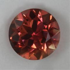 Fine complex mixture of orange yellow and red in a round.