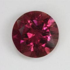 A rich pink that is a rose, droplet of color.