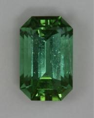 Bright open ended emerald cut with only one green hue.