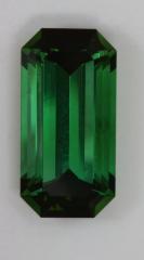 An exceptional solid green emerald cut with dark ends.