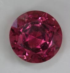 Large lightly included nice pink round.