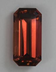 Smaller, long ratio Dravite emerald cut.