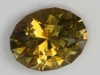 Dichroic yellow green with gold, touch of brown oval.