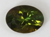 Dichroic darker grass green and bownish yellow green oval
