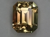 Bright yellow eye candy with orange shadow, emerald cut.