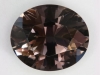 Moderately dark gray oval that was probably heated.