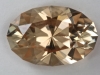 Slightlly included dichroic  pale peach with cream end  oval