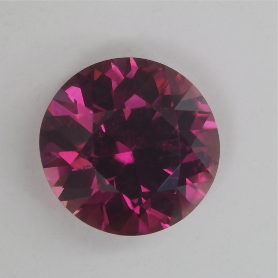 Moderately dark toned pink with touch of purple droplet of color.  #2