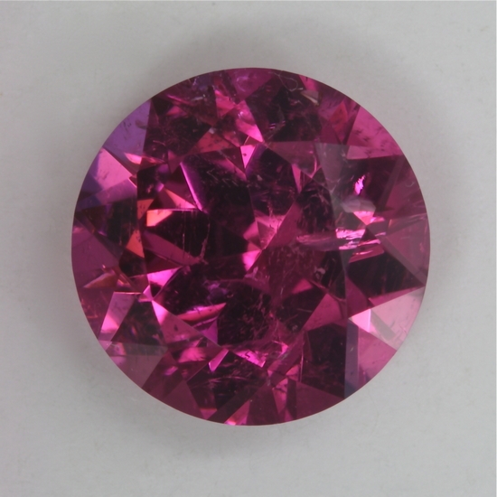 Moderately included, average pink round.  #26