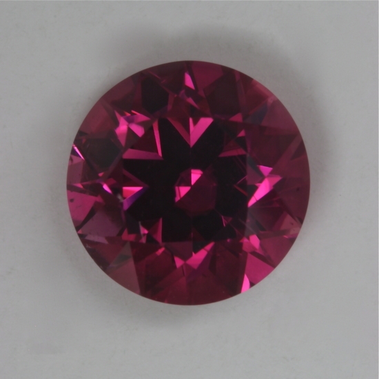 A medium toned, middle of the road rider of a pink, round.  #36