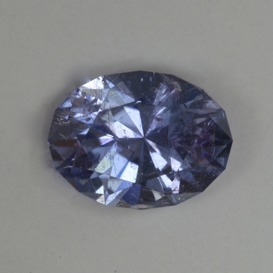 Visibly included purplish blue oval.  #554