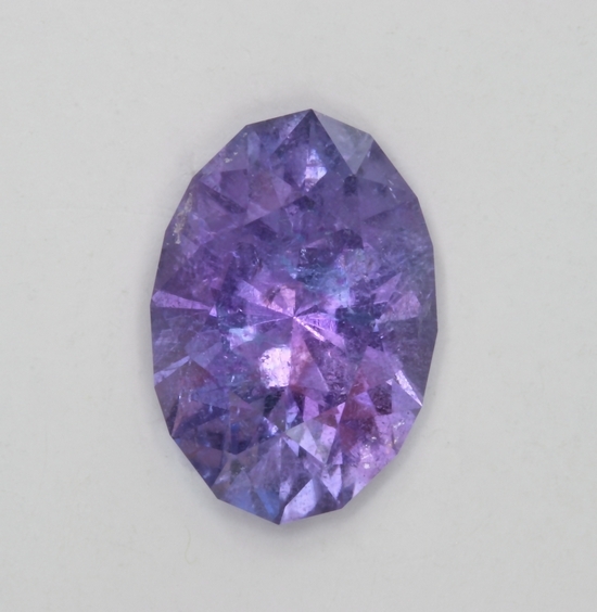 Included cuprian oval with mixed blue/purple/pink color.  #592