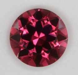 A fine, eye clean, medium toned, rose colored, droplet of color.  #623