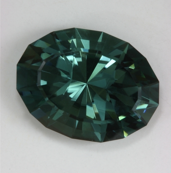 Great blue green non dichroic medium toned oval.