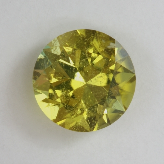 There is a light veil threw half the round, but its yellow color makes for a great gemstone.  #830