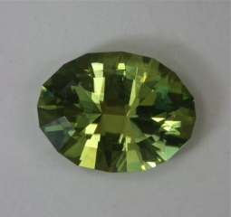 Bright, beautiful yellow green oval with a two step crown.  #51