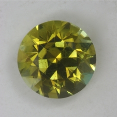 A bright yellow with a wash of green, piece of eye candy, round.  #92