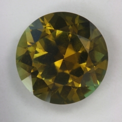 A darker more common, yellow green variety of tourmaline, round  #93