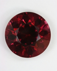 A beautiful brown red to red round.  #99