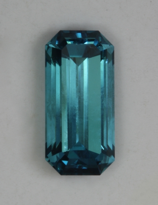 long narrow emerald cut with a great Namibian blue color.