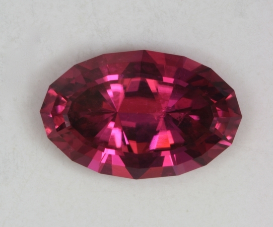 Hot pink, long ratio oval with very flashy ends.