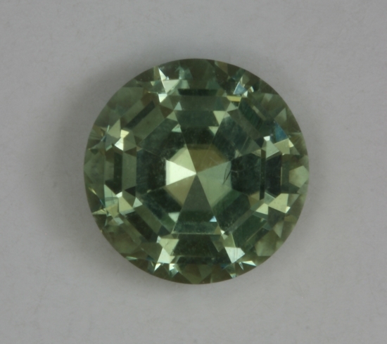 Deeply cut, eye clean, yellow green, round.