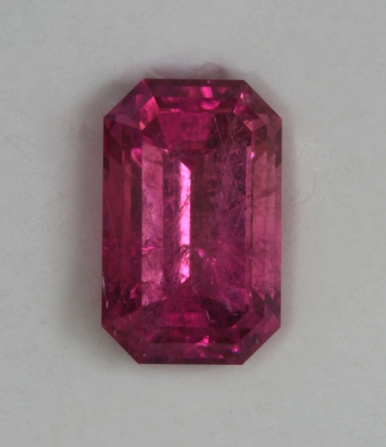 Included hot pink emerald cut.