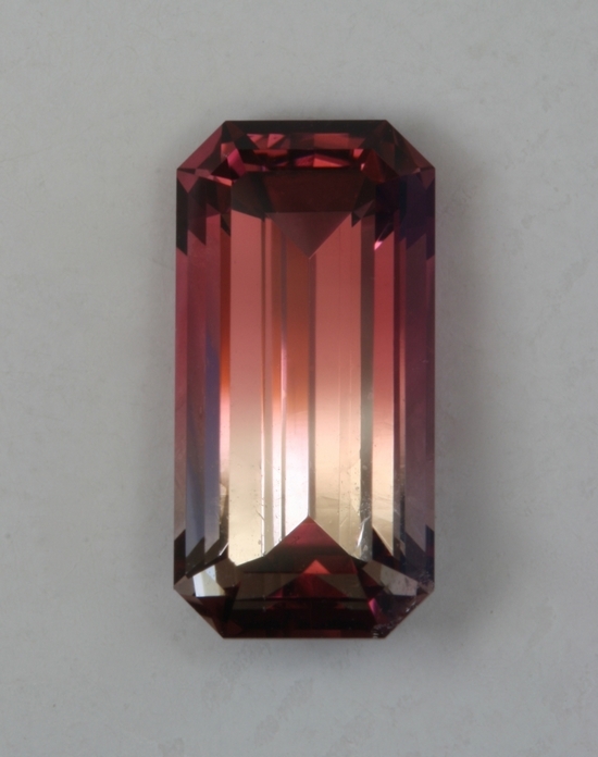 A very nice bicolor of two thirds pink and one third gray. emerald cut