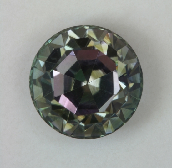 Green purple bicolor cut with table perpendicular to the principle axis, round