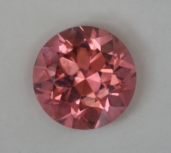 Pink with a touch of orange, eye clean, droplet of color