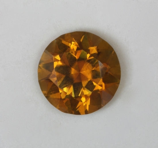 A golden yellow that verges on to orange, droplet of color.