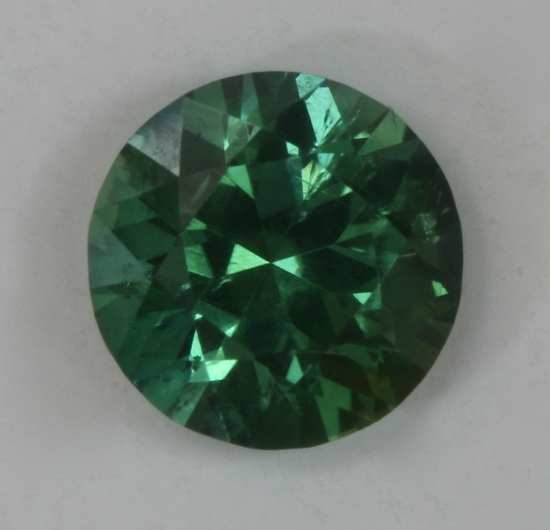 Smaller, green with overtone of blue droplet of color #135