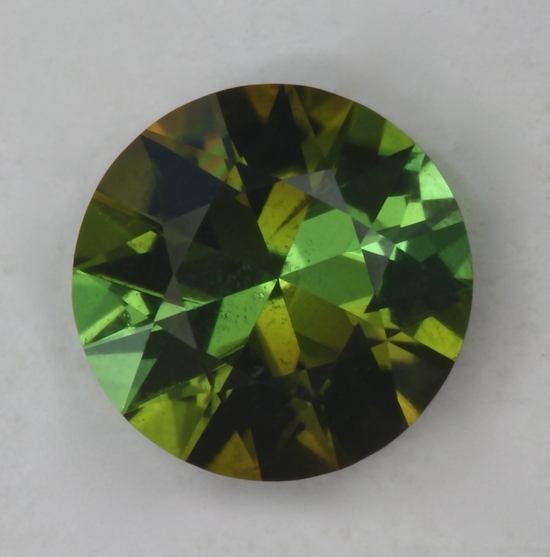 Alternating pie slices of green an yellow green in dichroic round.  #163