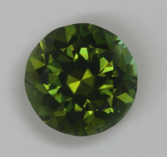 A medium dark green with touch of gold, cuprian, droplet of color.  #165