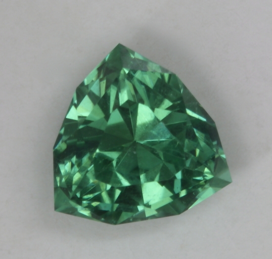 Richer pastel blue green in a bit of a haze, trilliant cut.  #180