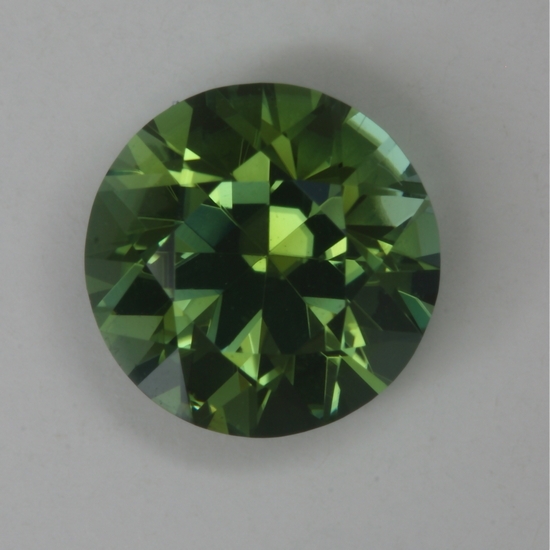 Bright, eye clean, medium toned green round.  #191