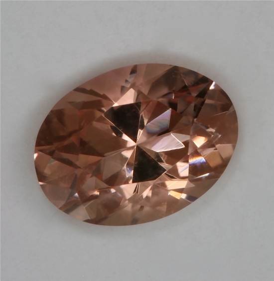 Lightly toned peach oval.  #257