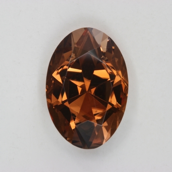 A brown, long ratio, oval that is cuprian.  #268