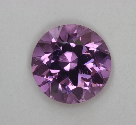 Excellent, medium light, slightly included, pastel lavander round.  #271