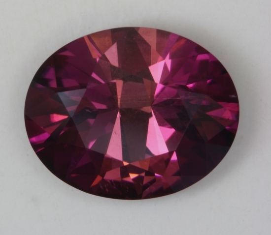A fine dichroic pink with a purplish cast oval.  #274